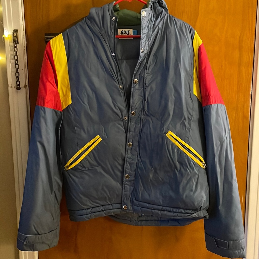 Multicolor puffer jacket, size large.